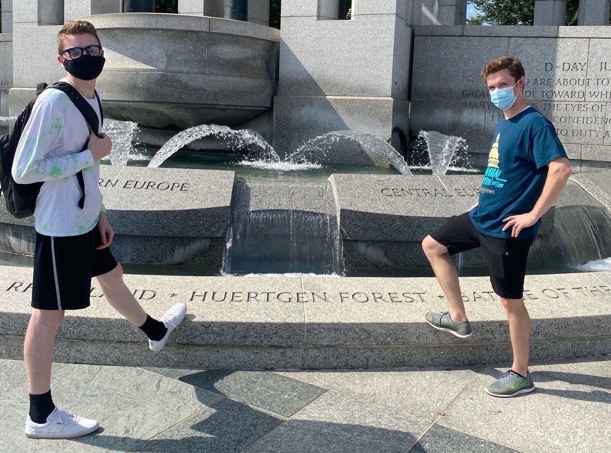 Interns posing by a fountain 